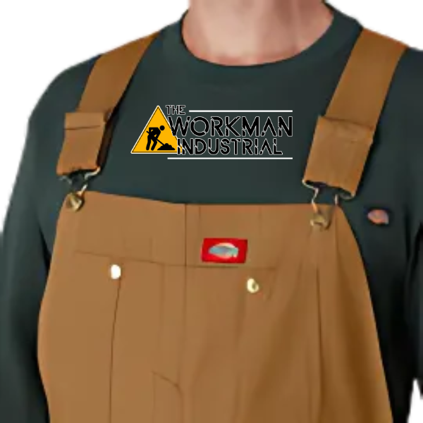 Close-up of the bib chest pockets and brass hardware on the Dickies overalls.